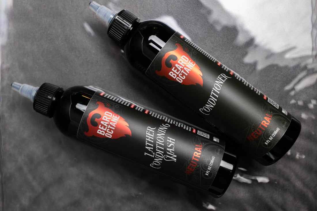 Unscented neutral range beard octane conditioner bottles with black packaging and logo, designed for men's grooming, on a gray surface.